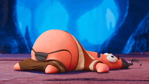A Cartoon Character Is Laying On The Ground Wearing A Pirate Costume GIF