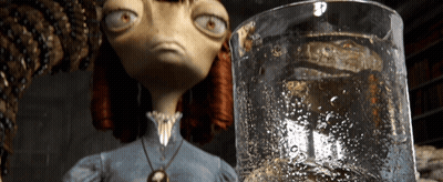 A Cartoon Character Is Looking At A Glass Of Liquid GIF