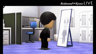 A Cartoon Character Is Looking At His Reflection In A Mirror With The Words Redmond Kyoto Live Above Him GIF