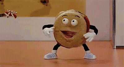A Cartoon Character Is Playing A Guitar While Standing On A Table . GIF
