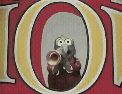 A Cartoon Character Is Playing A Trumpet In Front Of A Red And Yellow Sign . GIF