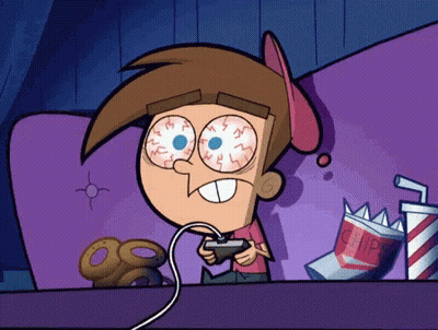 A Cartoon Character Is Playing A Video Game With A Bag Of Chips Behind Him GIF