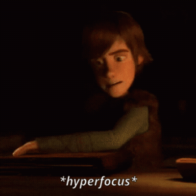 A Cartoon Character Is Reading A Book And The Word Hyperfocus Is Below Him GIF