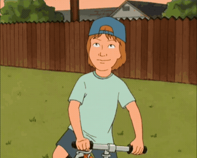A Cartoon Character Is Riding A Bike In A Yard GIF