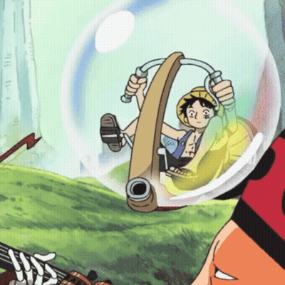 A Cartoon Character Is Riding In A Bubble With A Cannon GIF