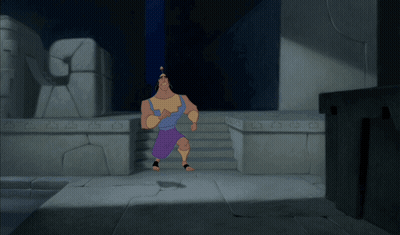 A Cartoon Character Is Running In A Dark Room With A Stone Wall Behind Him That Says ' A ' On It GIF