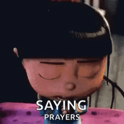A Cartoon Character Is Saying Prayers While Sitting On A Bed . GIF