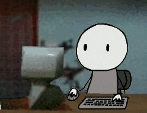 A Cartoon Character Is Sitting At A Desk Using A Keyboard And Mouse GIF