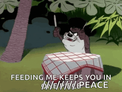 A Cartoon Character Is Sitting At A Table Holding A Knife And Says Feeding Me Keeps You In Peace . GIF