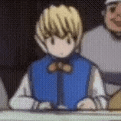 A Cartoon Character Is Sitting At A Table With A Bow Tie . GIF