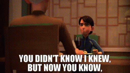 A Cartoon Character Is Sitting At A Table With A Man And A Boy . GIF