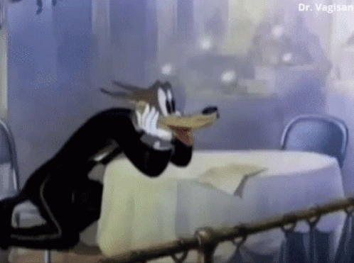 A Cartoon Character Is Sitting At A Table With A White Table Cloth . GIF