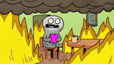 A Cartoon Character Is Sitting At A Table With Flames Coming Out Of It GIF