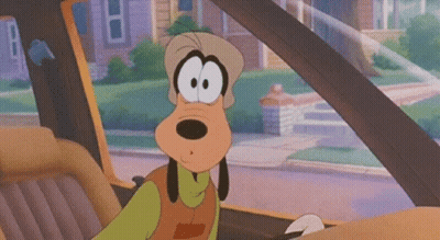 A Cartoon Character Is Sitting In A Car And Looking Out The Window . GIF