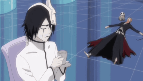 A Cartoon Character Is Sitting In A Chair Holding A Cup And Saucer GIF