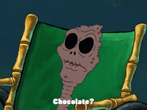 A Cartoon Character Is Sitting In A Chair With The Words " I Remember When They First Invented Chocolate " GIF