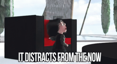 A Cartoon Character Is Sitting In A Chair With The Words It Distracts From The Now GIF