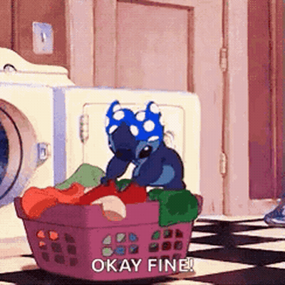 A Cartoon Character Is Sitting In A Laundry Basket With Clothes And Says `` Okay Fine '' . GIF