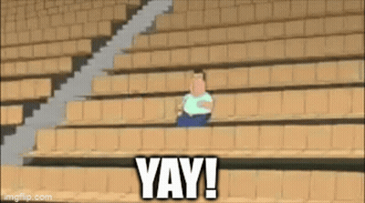 A Cartoon Character Is Sitting In A Stadium With The Words Yay Written Below Him GIF
