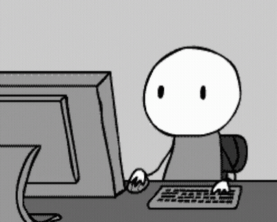 A Cartoon Character Is Sitting In Front Of A Computer Monitor GIF