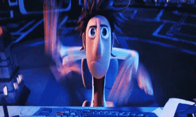 A Cartoon Character Is Sitting In Front Of A Computer GIF