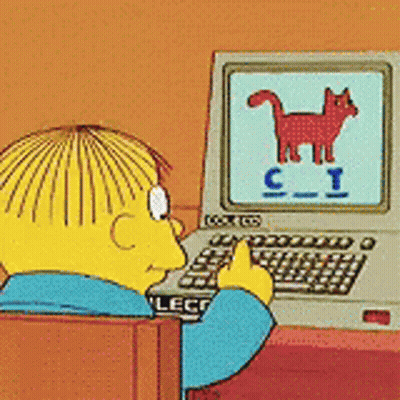 A Cartoon Character Is Sitting In Front Of A Computer With The Letter C On The Screen GIF
