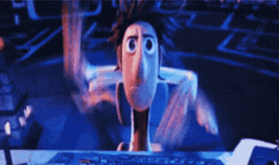 A Cartoon Character Is Sitting In Front Of A Computer GIF