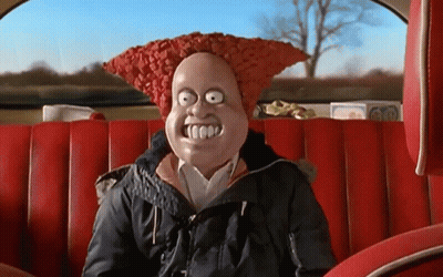 A Cartoon Character Is Sitting In The Back Seat Of A Car With A Huge Smile On His Face GIF