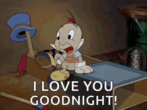 A Cartoon Character Is Sitting On A Bed Saying I Love You Goodnight . GIF