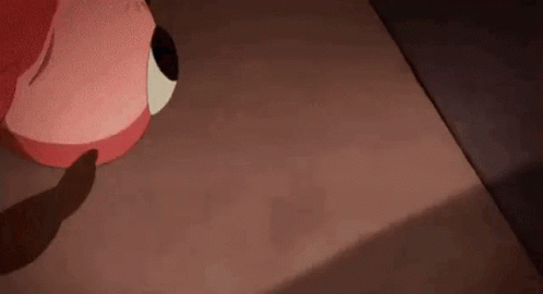 A Cartoon Character Is Sitting On A Bed With A Shadow Of A Person On The Floor . GIF