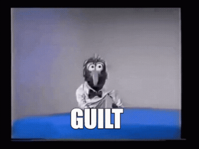 A Cartoon Character Is Sitting On A Blue Couch With The Word Guilt Written On It . GIF