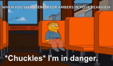 A Cartoon Character Is Sitting On A Bus With The Words `` Chuckles '' I 'M In Danger '' . GIF