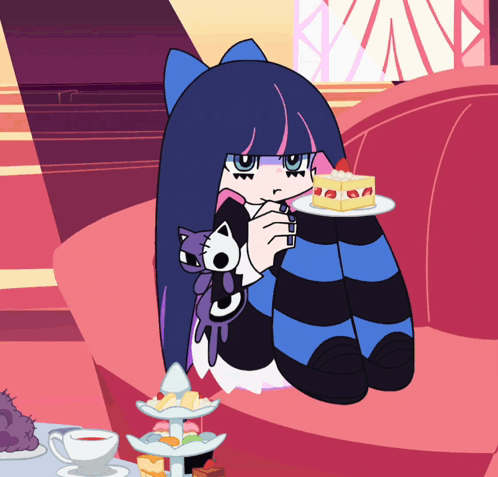 A Cartoon Character Is Sitting On A Couch Holding A Plate Of Cake GIF