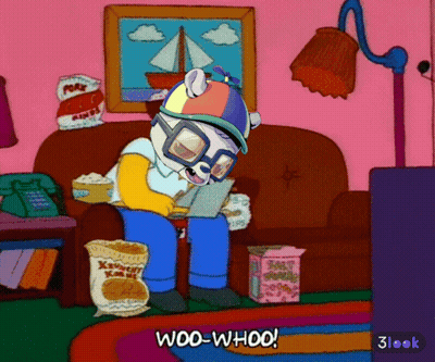 A Cartoon Character Is Sitting On A Couch With A Bag Of Popcorn And The Words Woo-Whoo On The Bottom GIF