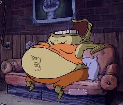 A Cartoon Character Is Sitting On A Couch With A Picture Of A Fist Behind Him GIF