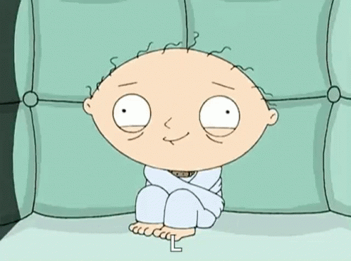 A Cartoon Character Is Sitting On A Couch With His Legs Crossed GIF