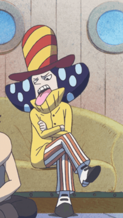 A Cartoon Character Is Sitting On A Couch With His Tongue Sticking Out GIF