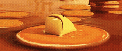 A Cartoon Character Is Sitting On A Pancake With A Slice Of Toast Sticking Out Of It GIF