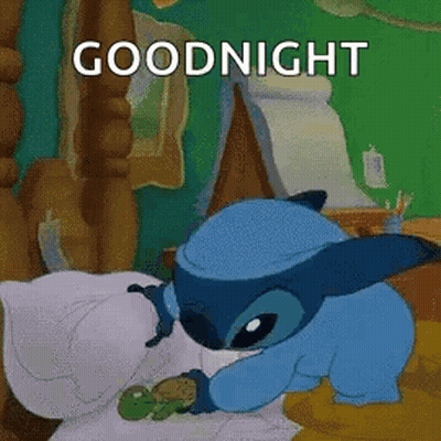 A Cartoon Character Is Sleeping In A Bed With A Turtle And The Words `` Goodnight '' . GIF