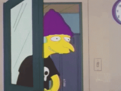 A Cartoon Character Is Standing In A Doorway Wearing A Purple Hat And Headphones . GIF