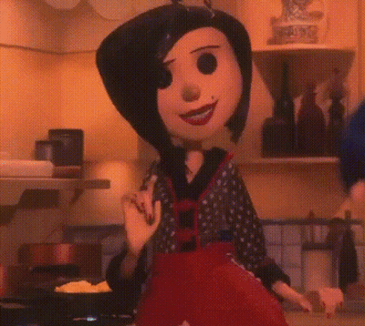A Cartoon Character Is Standing In A Kitchen With A Frying Pan In Front Of Her . GIF