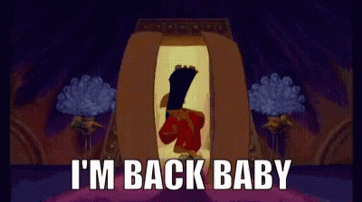 A Cartoon Character Is Standing In A Room With The Words I 'M Back Baby On The Bottom GIF