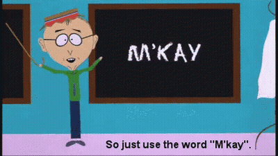 A Cartoon Character Is Standing In Front Of A Blackboard That Says M'kay GIF
