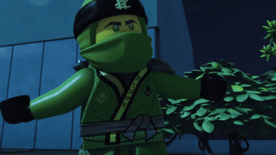 A Cartoon Character Is Standing In Front Of A Building With A Green Light Coming Out Of His Head GIF