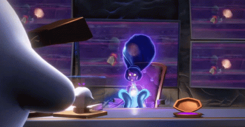 A Cartoon Character Is Standing In Front Of A Computer Monitor GIF