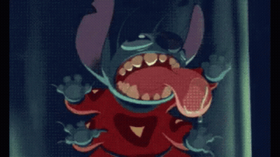 A Cartoon Character Is Standing In Front Of A Dark Curtain GIF