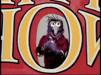 A Cartoon Character Is Standing In Front Of A Sign That Says Joy GIF