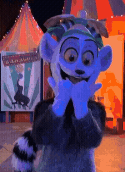 A Cartoon Character Is Standing In Front Of A Sign That Says ' Madagascar ' GIF