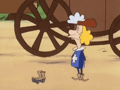 A Cartoon Character Is Standing In Front Of A Wagon Wheel GIF