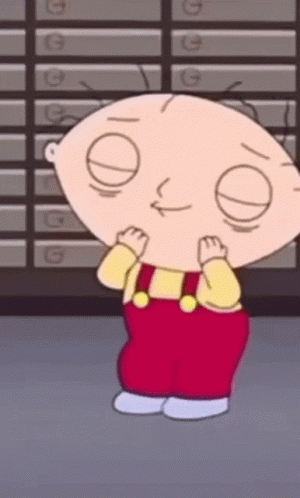 A Cartoon Character Is Standing In Front Of A Wall With Letters G On It . GIF